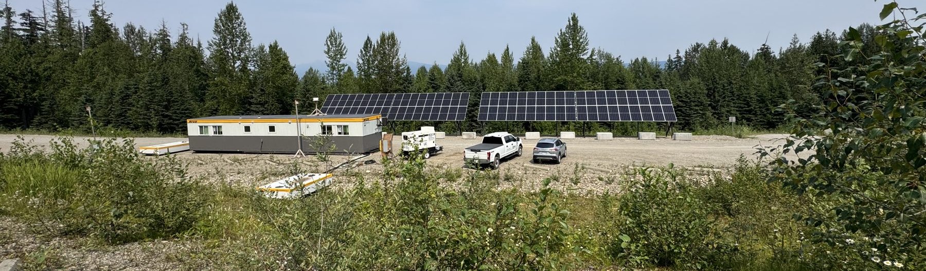 Off-grid solar array installed in a remote forest setting in northern British Columbia